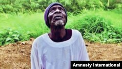 A man watches military aircraft fly overhead in South Kordofan, Sudan, August 2011. Following the outbreak of conflict in the region in June, the Sudanese government repeatedly carried out indiscriminate aerial bombardments in South Kordofan.