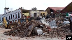 Pro-democracy demonstrators face water canons as police try to clear the protest venue in Bangkok, Thailand.
