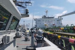 រូបថតដែលត្រូវបានផ្សព្វផ្សាយដោយយោធាជើងទឹកឥណ្ឌូណេស៊ីកាលពីថ្ងៃទី ២៤ ខែសីហា ឆ្នាំ២០២១ បង្ហាញនាវាដឹកប្រេង MT. Strovolos សំចតនៅកំពង់ផែមួយនៅតំបន់ប្រជុំកោះ Riau។ (AFP PHOTO / INDONESIAN NAVY)