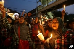 Supporters of Jakarta Gov. Basuki "Ahok" Tjahaja Purnama who is imprisoned for blaspheming Islam shout slogans during a protest outside the High Court in Jakarta, Indonesia, May 16, 2017. The imprisonment of the Christian politician has triggered an outpouring of anger and support around Indonesia.