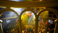 People dance in close proximity at Paradiso pop venue, club and cultural center, in Amsterdam, Sept. 25, 2021, the day the Netherlands dropped the coronavirus-related 1.5-meter distancing rule.