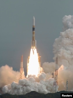 FILE - An H2-A rocket carrying Japan's fourth spy satellite blasts off from the southern island of Tanegashima, Feb. 24, 2007.
