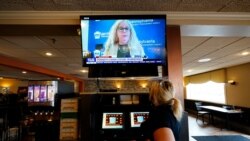 Waitress Lauren Musial watches a television briefing by Pennsylvania Health Secretary, Dr. Rachel Levine, at the Penrose Diner, Tuesday, Nov. 17, 2020, in South Philadelphia. Philadelphia plans to prohibit indoor dining at restaurants, shutter…