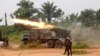 FILE - Congolese soldiers from the Armed Forces of the Democratic Republic of Congo [FARDC] launch missiles during their military operation against Ugandan Islamist group, the Allied Democratic Forces, outside the town of Beni, in North Kivu province, Dem