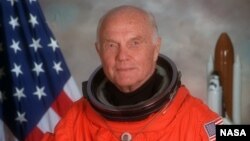 FILE - John Glenn in a flight suit.