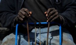Horace Bell, 60, of Americus, Ga., controls an excavator while digging a grave at the Cedar Hill Cemetery on April 18, 2020, in Dawson, Ga.