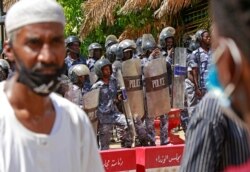 Sudanese protesters shout slogans outside the Council of Ministers in Sudan's capital, Khartoum, Aug. 17, 2020.