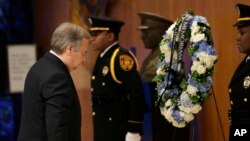 New United Nations Secretary-General Antonio Guterres, left, participates in a ceremony to honor U.N. employees killed in the line of duty at U.N. headquarters, Tuesday, Jan. 3, 2017. (AP Photo/Seth Wenig)