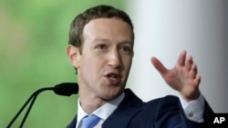 FILE - Facebook CEO Mark Zuckerberg speaks at Harvard University in Cambridge, Mass., May 25, 2017. He says Russia's Internet Research Agency "has repeatedly acted to deceive people and manipulate people around the world, and we don't want them on Facebook anywhere."