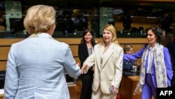 Ukrainian Deputy Prime Minister Olga Stefanishyna, center, shakes hands with Croatian State Secretary for European Affairs Andreja Metelko-Zgombic before starting talks about Ukraine joining the European Union, in Luxembourg on June 25, 2024.