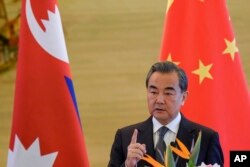 China's Foreign Minister Wang Yi speaks after a meeting with Nepal's Deputy Prime Minister Krishna Bahadur Mahara, Sept. 7, 2017, in Beijing.