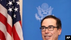 Steven Mnuchin, U.S. Treasury Secretary speaks to media at the venue of G20 Finance Minister and Central Bank Governors Meeting Saturday, June 8, 2019, in Fukuoka, western Japan. (AP Photo/Eugene Hoshiko)