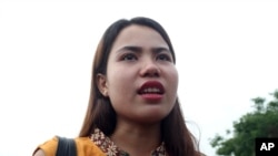 Chit Su Win, wife of Reuters journalist Kyaw Soe Oo, talks to journalists as she leaves the Supreme Court in Naypyitaw, Myanmar, Tuesday, April 23, 2019. (AP Photo/Aung Shine Oo)