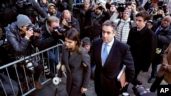 Michael Cohen, center, President Donald Trump's former lawyer, accompanied by his children Samantha, left, and Jake, right, arrives at federal court for his sentencing in New York, Dec. 12, 2018.