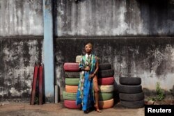 Singer Temi Dollface poses for a picture in the compound where she works from, in the Ikeja district of Lagos, Nigeria, May 18, 2016.