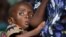 A Malawian child, suffering from HIV, breastfeeds at the Zomba NRU (Nutritional and Rehabilitation Unit), 60 kms south of Blantyre, October 14, 2005 file photo. 