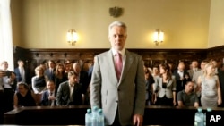FILE - Ukrainian oligarch Dmytro Firtash waits for the start of his trial at the Austrian supreme court in Vienna, June 25, 2019.