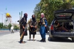 Taliban fighters patrol inside the city of Ghazni, southwest of Kabul, Afghanistan, Aug. 12, 2021.