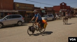 Deven Perkins is riding his bike from Maine to California