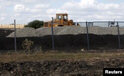 An excavator is seen at a construction site for Russia's new military base near the Russian-Ukrainian border in the village of Soloti, southeast of Belgorod, Russia, Sept. 7, 2015.