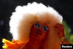 A participant wearing a costume prepares for the 40th anniversary of the Sydney Gay and Lesbian Mardi Gras Parade in central Sydney, March 3, 2018.