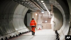 FILE - An armed guard walks through the Svalbard Global Seed Vault Monday Feb. 25, 2008 in Longyearbyen, Norway.