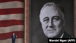U.K. -- U.S. President Donald Trump stands and speaks during an event to commemorate the 75th anniversary of the D-Day landings, in Portsmouth, June 5, 2019.