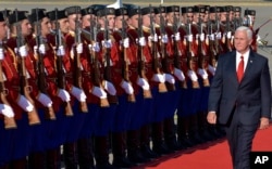 FILE - U.S. Vice President Mike Pence attended a welcome ceremony at Golubovci airport, near Podgorica, Montenegro, Aug. 1, 2017. Pence attended the Adriatic Charter Summit in NATO's newest member — Montenegro.