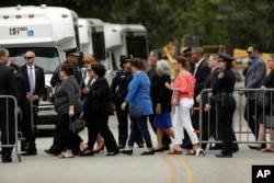 People arrive at St. Martin's Episcopal Church for the visitation of former first lady Barbara Bush in Houston, April 20, 2018.