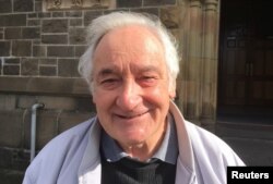 Local resident Reiny Strybosch stands outside the St. Patrick's Cathedral in Cardinal George Pell's hometown, just days before the Vatican treasurer's first court appearance on historic sex charges, in the town of Ballarat, located west of the southern city of Melbourne in Australia, July 24, 2017.