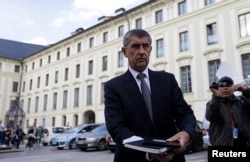 FILE - Czech Finance Minister Andrej Babis leaves Prague Castle, after meeting with President Milos Zeman in Prague, May 3, 2017.