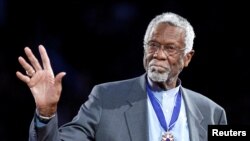 FILE PHOTO: Russell stands with his Presidential Medal of Freedom during the NBA All-Star basketball game in Los Angeles