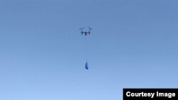 Walmart's drone delivery system is shown during a demonstration of the system. (Walmart)