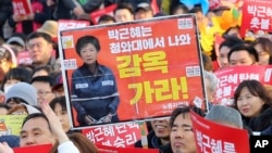 Protesters rally calling for impeached President Park Geun-hye's arrest in Seoul, South Korea, March 11, 2017.