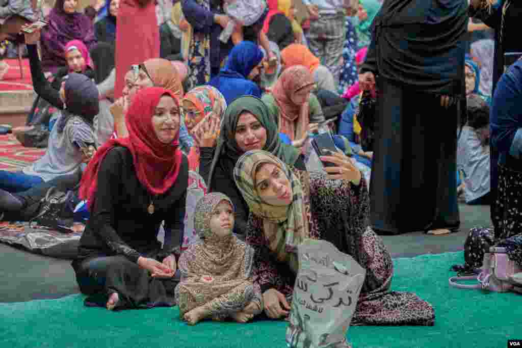 After finishing the prayers, friends, and relatives pose for selfies together in the ancient mosque of Sultan Hassan in Old Cairo.&#160;(H. Elrasam/VOA)