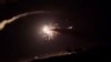 FILE - This frame grab from a video provided by the Syrian official news agency SANA shows missiles flying into the sky near Damascus, Syria, Dec. 25, 2018. Israeli warplanes flying over Lebanon fired missiles toward areas near the Syrian capital, Syrian state media reported.
