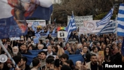 People gather during a protest against a bill allowing same-sex marriage ahead of the vote in parliament in Athens, Greece, Feb. 11, 2024.