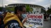 FILE - People take part in a protest against the hosting of the 2020 Tokyo Olympic Games outside the Olympic museum in Tokyo on May 9, 2021. (AFP)