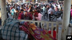 Indian daily wage laborers wait to get hired in Mumbai, India, Feb 1, 2020.