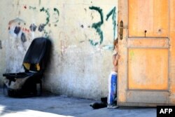 A girl, member of the Roma community, is pictured at the "River Village" Roma camp, managed by the Onlus Isola Verde association in Rome, Italy, jUNE 19, 2018.