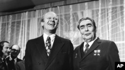 U.S. President Gerald Ford and Soviet Communist Party chief and the state leader Leonid Brezhnev share a joke just before their summit meeting in Vladivostok in this Nov. 24, 1974 file photo. (AP Photo/File)