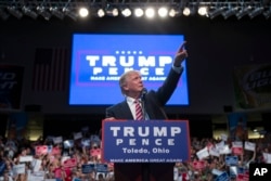 Republican presidential candidate Donald Trump points to the crowd as he speaks during a campaign rally, July 27, 2016, in Toledo, Ohio.