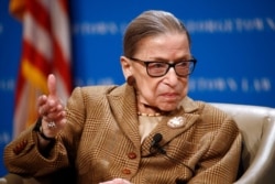 FILE - U.S. Supreme Court Justice Ruth Bader Ginsburg speaks during a discussion on the 100th anniversary of the ratification of the 19th Amendment at Georgetown University Law Center in Washington, Feb. 10, 2020.
