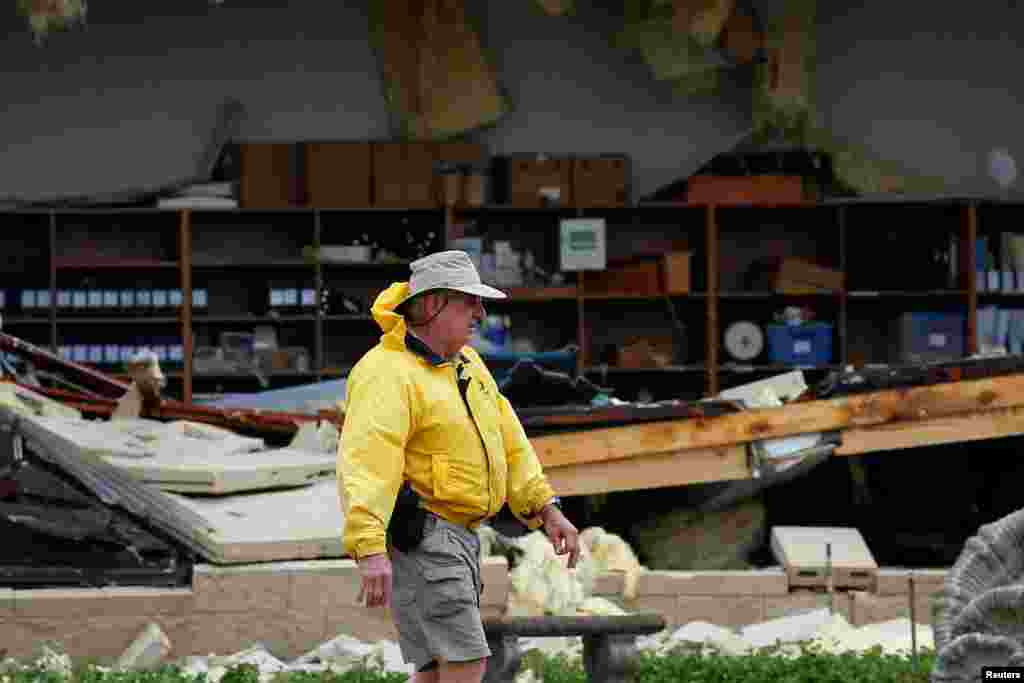 A man assesses damage to the First Baptist Church after it was hit by Hurricane Harvey in Rockport, Texas, Aug. 26, 2017.