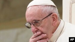 FILE - Pope Francis holds his weekly general audience at the Vatican, Aug. 22, 2018. 