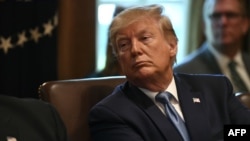 Presiden AS Donald Trump dalam rapat kabinet di Gedung Putih, 16 Juli 2019. 