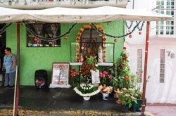 A makeshift altar honors the Virgin of Guadalupe in Mexico City, Dec. 12, 2020. Mexico's Catholics were forced by the pandemic to abandon a religious pilgrimage in which millions visit the Basilica of Guadalupe on Dec. 12, the Virgin's feast day.