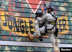 Members of the U.S. Army National Guard demonstrate rappelling skills during the Urban Search and Rescue activity of the 2016 RP-U.S. Balikatan joint military exercises in Camp Capinpin in Tanay, Rizal, east of Manila, Philippines, April 8, 2016.