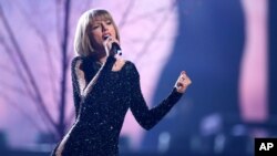FILE - Taylor Swift performs at the 58th annual Grammy Awards in Los Angeles, Feb. 15, 2016.