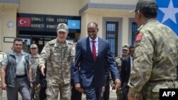 Corazzieri of the Italian military Presidential honour guards stand guard at the Quirinale Palace in Rome prior to political leaders arriving for meetings with the president on forming a new government following the resignation of the prime minister.